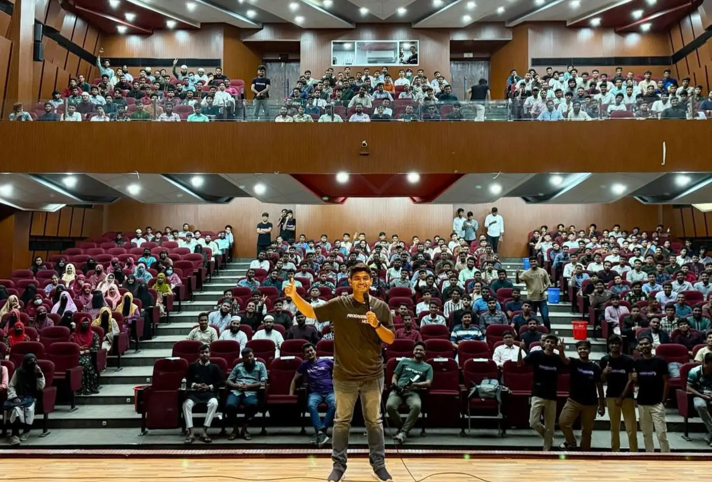 A Programming Hero session in a packed university auditorium